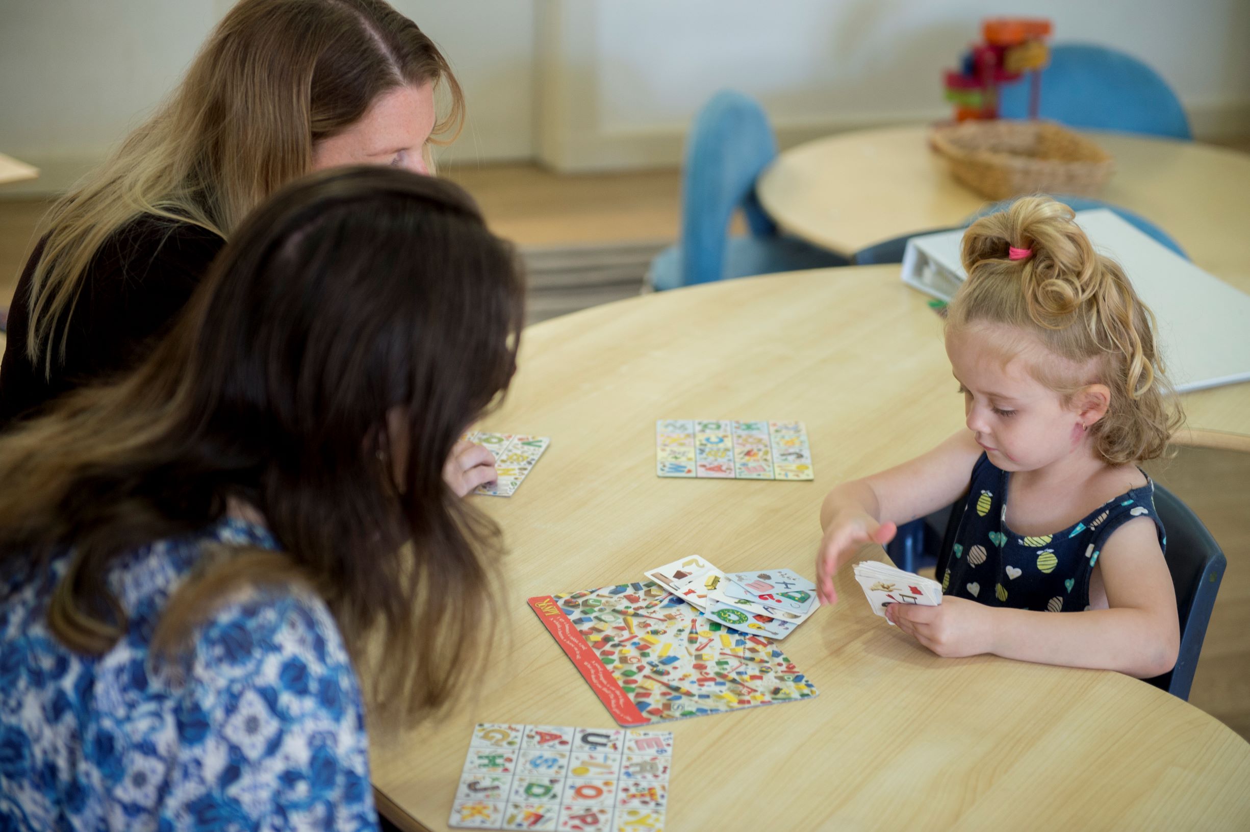Teacher painting with child